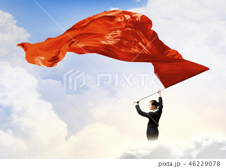 Woman waving red flag 46229078