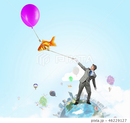 Humorous guy with balloons 46229127