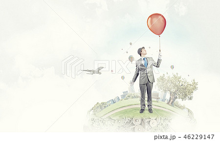 Humorous guy with balloons 46229147