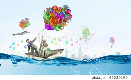 Humorous guy with balloons 46229166