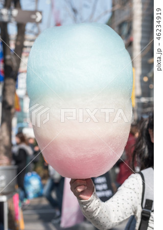 Cotton candy in kid hand, sugar cloud colorful Cotton candy in kid hand, sugar cloud colorful 46234919