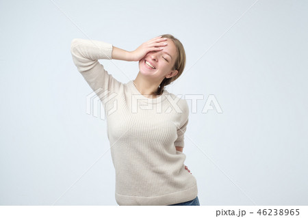 Laughing caucasian woman over white wall. 46238965