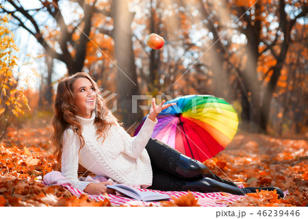 Girl in autumn forest 46239446