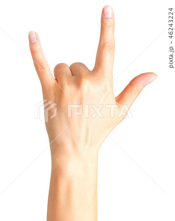 Female hand showing rock n roll sign or giving the devil horns gesture 46243224