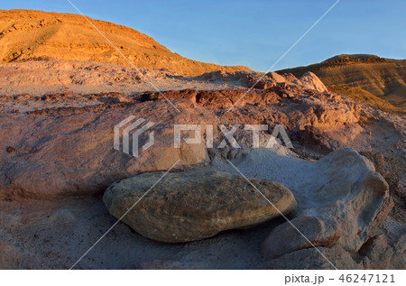 Sunset at colourful rocks and sand of Yeruham wadi 46247121
