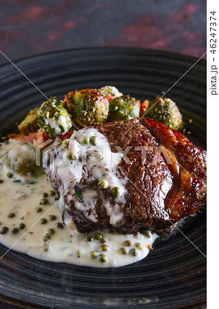 Beefsteak with Brussels sprouts and pea sauce Beefsteak with Brussels sprouts and pea sauce 46247374
