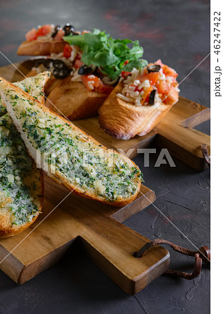 Set of toasts with tomato, onion, cheese and olive 46247422