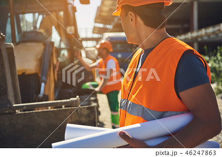Employees of construction company are working outdoor 46247863