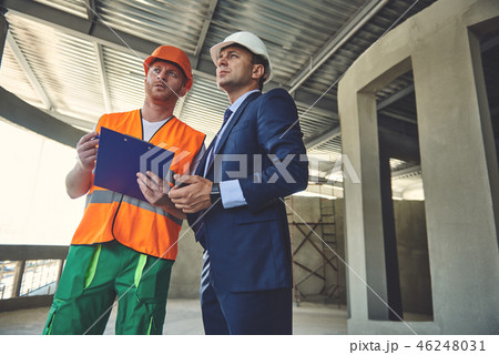 Architect with foreman are standing on workplace 46248031