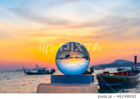 beautiful sunrise in clear quartz crystal ball 46248092
