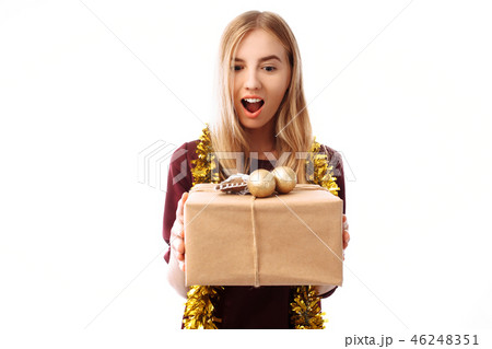 Cheerful girl in the hat of Santa Claus looking Cheerful girl in the hat of Santa Claus looking 46248351