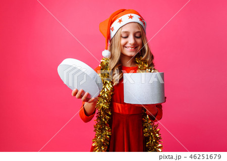 happy girl in Santa hat and with tinsel  46251679