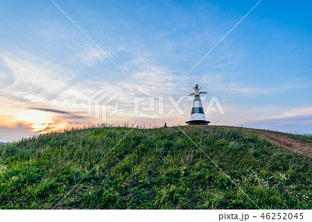 Beacon with pointer on the hill in sunset light 46252045