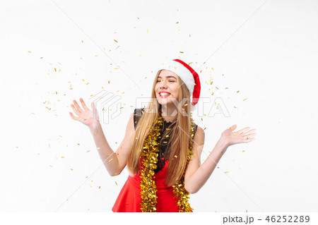woman in santa hat and dress celebrating new year 46252289