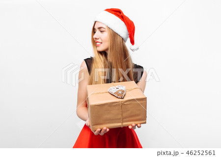 woman in santa hat and dress celebrating new year 46252561