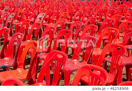 Group of red plastic chairs 46258906
