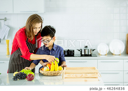 Mother and son in modern kitchen. 46264836