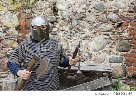 Medieval old knight helmet and chain mail for protection in battle. Very heavy headdress on stand in 46265244