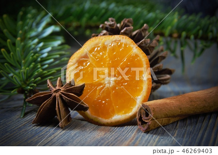 Lemon, cinnamon and badian next to pine branch Lemon, cinnamon and badian next to pine branch 46269403