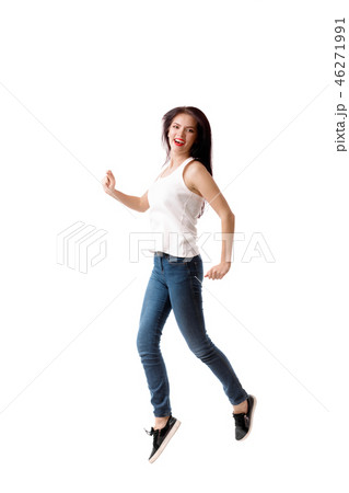 young woman is jumping on a white background young woman is jumping on a white background 46271991