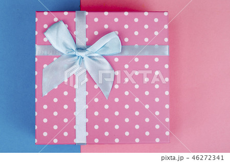 Square box of pink polka dots on bright background Square box of pink polka dots on bright background 46272341