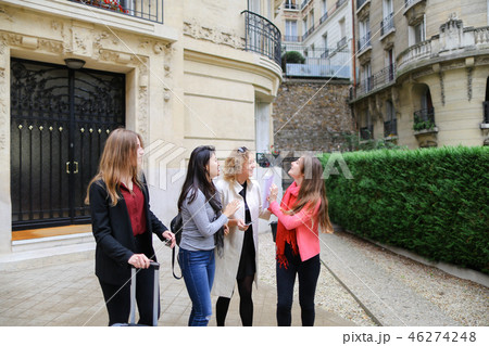 Happy students leaving university building in  . 46274248