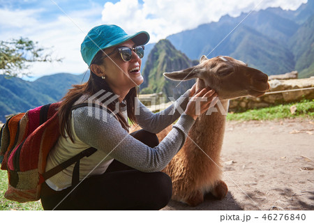 Smiling tourist woman with lama Smiling tourist woman with lama 46276840