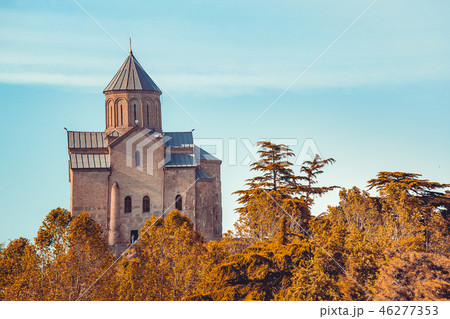 Ancient church among the autumn forest. Georgia. 46277353