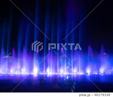 Colorful lights with blurry fountain, water show on black backgr 46279336