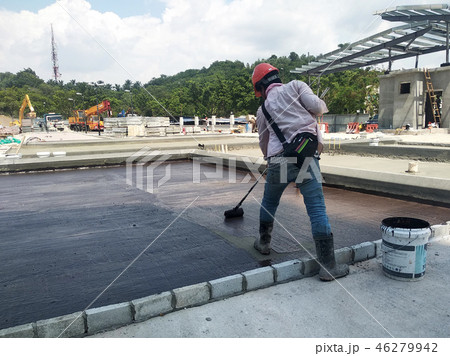 Waterproofing membrane applied by workers 46279942