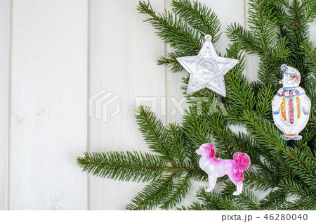 Spruce branch with old vintage Christmas toys 46280040
