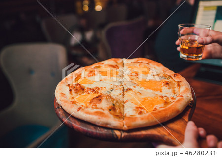 Young woman holding plate with tasty pizza, close up view. Young woman holding plate with tasty pizza, close up view. 46280231