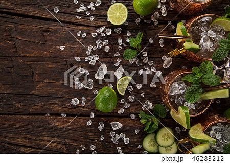 Famous Moscow mule alcoholic cocktail in copper mugs. 46283212