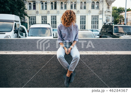 Unrecognizable young woman holding smart phone 46284367