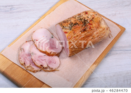 Homemade meatloaf from pork meat with spices on cutting board. Homemade meatloaf from pork meat with spices on cutting board. 46284470