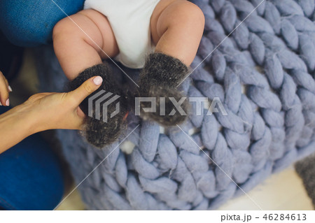 Beautiful cute baby feet in Gray socks. Beautiful cute baby feet in Gray socks. 46284613