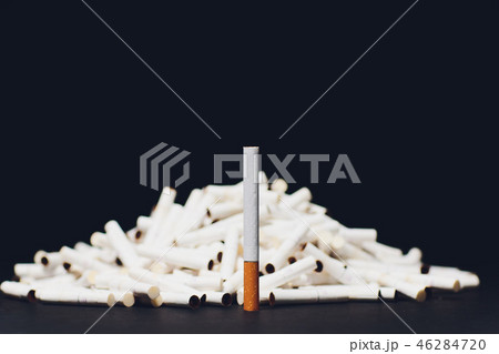 Newest electronic cigarettes, heating tobacco system IQOS, smoking, dark blue isolated on black 46284720