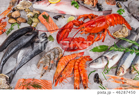 Fresh tasty seafood served on old wooden table. Fresh tasty seafood served on old wooden table. 46287450