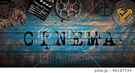 Cinema concept of vintage film reels, clapperboard and projector. 46287534
