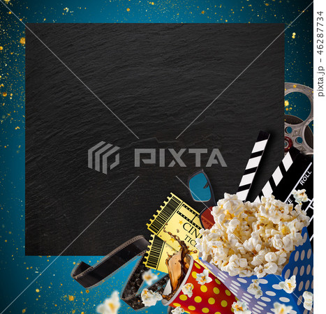 Pop-corn, movie tickets, clapperboard and other things in motion. Pop-corn, movie tickets, clapperboard and other things in motion. 46287734