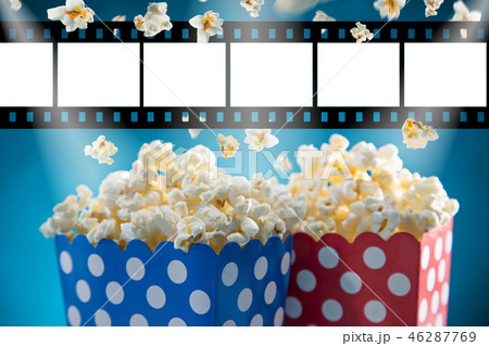 Boxes of popcorn on blue background. Boxes of popcorn on blue background. 46287769