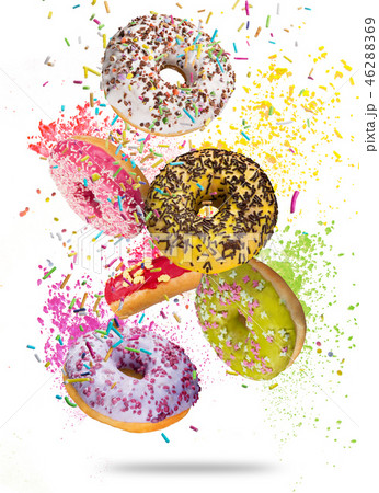 Tasty doughnuts in motion falling on white background. 46288369