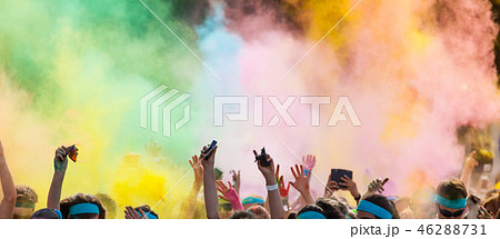 Close-up of marathon, people covered with colored powder. 46288731