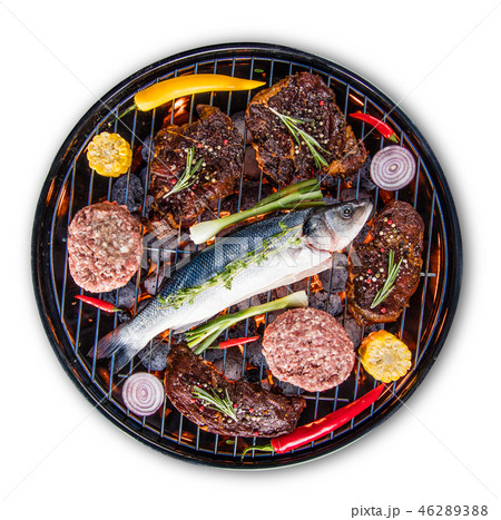 Barbecue grill with beef steaks, close-up. Barbecue grill with beef steaks, close-up. 46289388