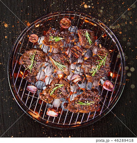 Barbecue grill with beef steaks, close-up. 46289418