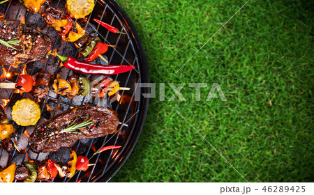 Barbecue grill with beef steaks, close-up. 46289425