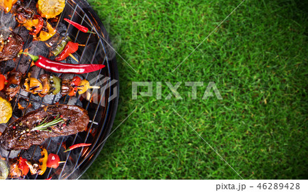 Barbecue grill with beef steaks, close-up. 46289428