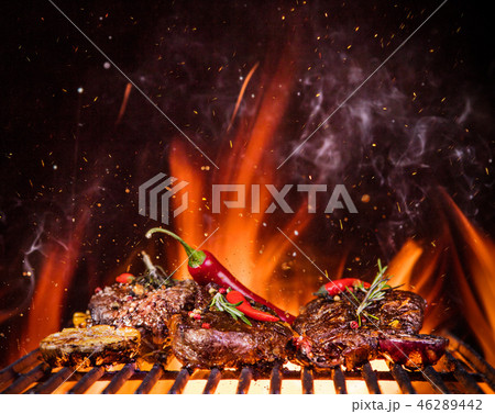 Beef steaks on the grill with flames 46289442