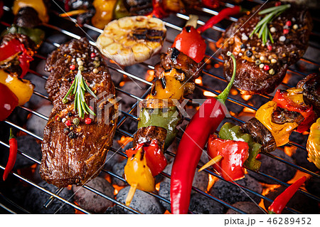 Barbecue grill with beef steaks, close-up. Barbecue grill with beef steaks, close-up. 46289452
