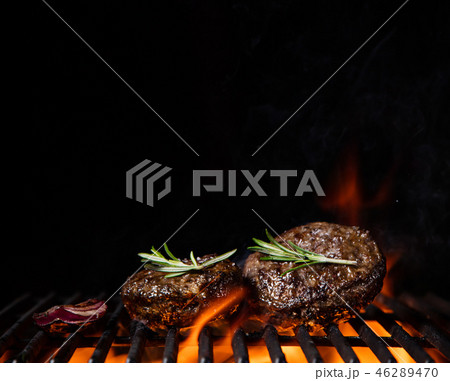 Beef steaks on the grill with flames Beef steaks on the grill with flames 46289470